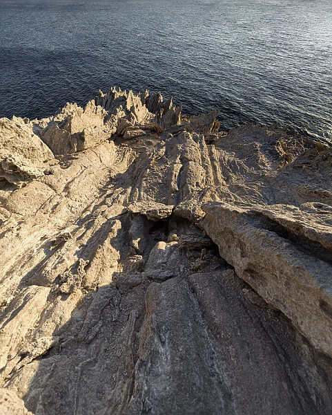 Harsh rock cliffs on Antiparos Island, Cyclades, Greek Islands, Greece, Europe