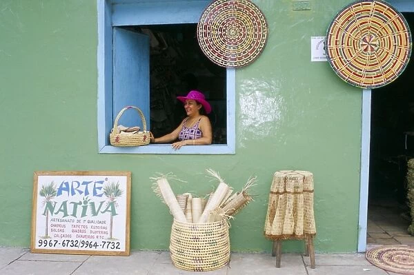 Hat seller in the window of her shop, Barreirinhas, Lencois Maranhenses