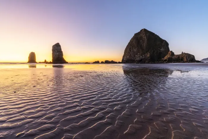 Framed Print : Haystack Rock and The Needles at sunset, with textured sand in the foreground Framed Print : Haystack Rock and The Needles at sunset, with textured sand in the foreground