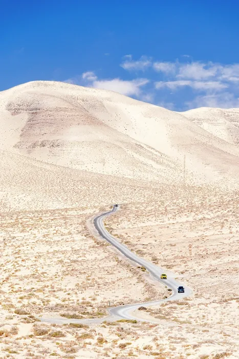 Framed Print : High angle view of cars driving on a winding desert road in the barren landscape, Jandia, Fuerteventura, Canary Islands, Spain Framed Print : High angle view of cars driving on a winding desert road in the barren landscape, Jandia, Fuerteventura, Canary Islands, Spain