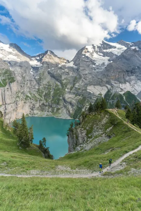 Framed Print : High angle view of two hikers walking on path above Oeschinensee lake, Bernese Oberland Framed Print : High angle view of two hikers walking on path above Oeschinensee lake, Bernese Oberland
