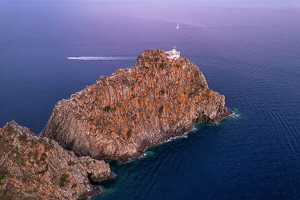 High angle view of the lighthouse of Ponza (Punta della Guardia lighthouse) on top of basalt cliff at dusk, Ponza island, Tyrrhenian Sea, Pontine islands, Latina Province, Latium (Lazio), Italy, Europe