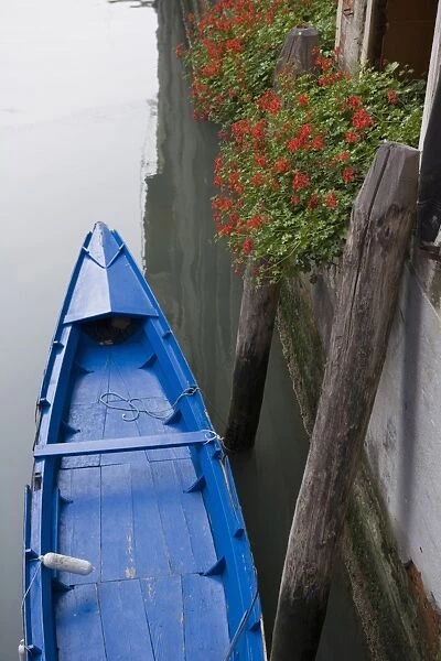 High view of blue boat in Canal, Venice, Veneto, Italy, Europe