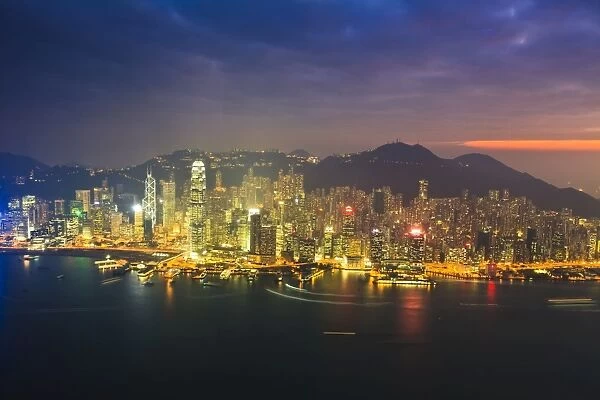 High view of the Hong Kong Island skyline and harbour at sunset, Hong Kong, China, Asia