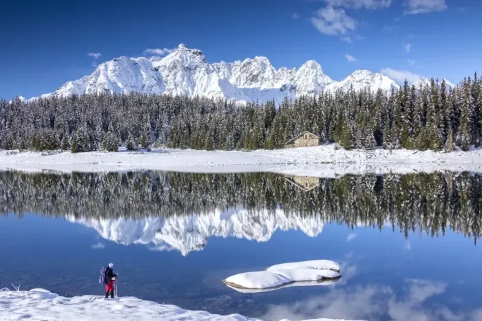 Framed Print : Hiker admires the snowy peaks and woods reflected in Lake Palu, Malenco Valley, Valtellina Framed Print : Hiker admires the snowy peaks and woods reflected in Lake Palu, Malenco Valley, Valtellina