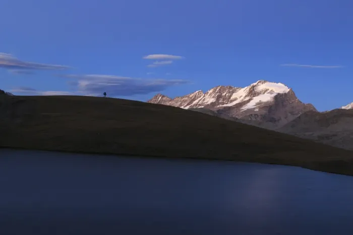 Framed Print : Hiker admires sunset on Rossett Lake at an altitude of 2709 meters, Gran Paradiso National Park Framed Print : Hiker admires sunset on Rossett Lake at an altitude of 2709 meters, Gran Paradiso National Park