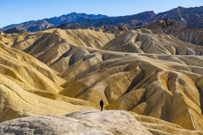 Framed Print : Hiker in the colourful sandstone formations, Zabriskie Point, Death Valley, California, United States of America, North America Framed Print : Hiker in the colourful sandstone formations, Zabriskie Point, Death Valley, California, United States of America, North America