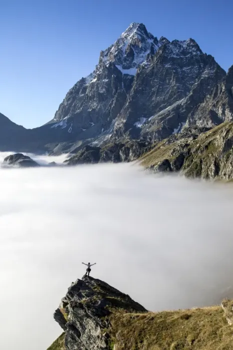 Framed Print : A hiker contemplating the Monviso Massif rising above a bed of clouds in the Cottian Alps, Piedmont, Italy, Europe Framed Print : A hiker contemplating the Monviso Massif rising above a bed of clouds in the Cottian Alps, Piedmont, Italy, Europe