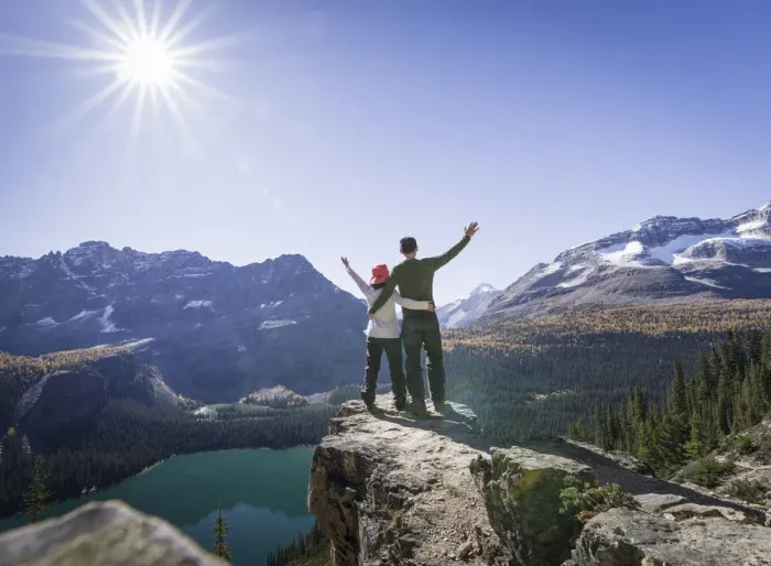 Framed Print : Hiker couple at the Alpine circuit trail looking down the Lake O Hara, Yoho National Park Framed Print : Hiker couple at the Alpine circuit trail looking down the Lake O Hara, Yoho National Park