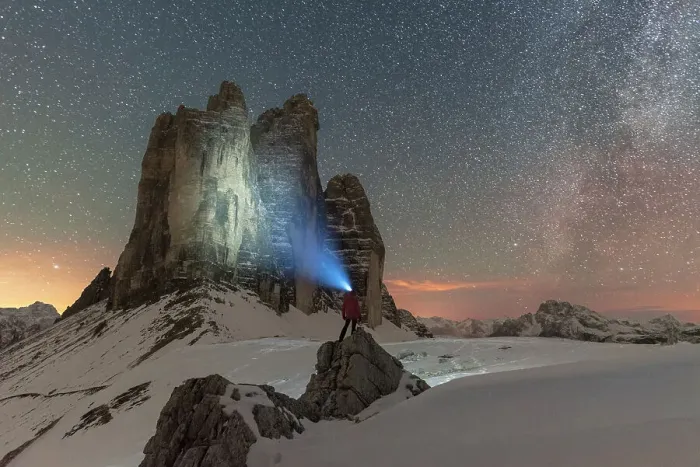 Framed Print : Hiker with head torch views the Tre Cime di Lavaredo on a starry night with the Milky Way, winter view, Tre Cime di Lavaredo (Lavaredo peaks), Sesto (Sexten), Dolomites, South Tyrol, Italy, Europe
