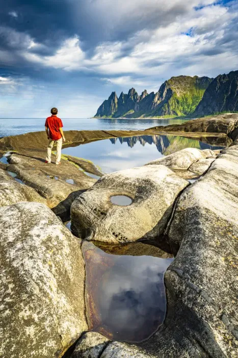 Framed Print : Hiker man contemplating the sharp rocks of mountain peaks standing beside rock pools Framed Print : Hiker man contemplating the sharp rocks of mountain peaks standing beside rock pools