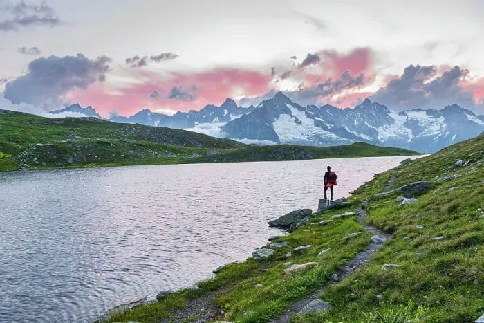 Framed Print : Hiker stands near the shore of Fenetre lake admiring the sunset over the massif of Mount Blanc, Ferret valley, Valais canton, Col du Grand-Saint-Bernard (St. Bernard mountain pass), Switzerland, Europe Framed Print : Hiker stands near the shore of Fenetre lake admiring the sunset over the massif of Mount Blanc, Ferret valley, Valais canton, Col du Grand-Saint-Bernard (St. Bernard mountain pass), Switzerland, Europe