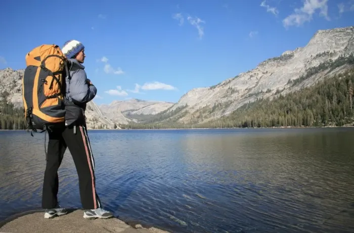 Framed Print : A hiker takes in the view on the shore of Tenaya Lake, in the Tuolumne Meadows Framed Print : A hiker takes in the view on the shore of Tenaya Lake, in the Tuolumne Meadows
