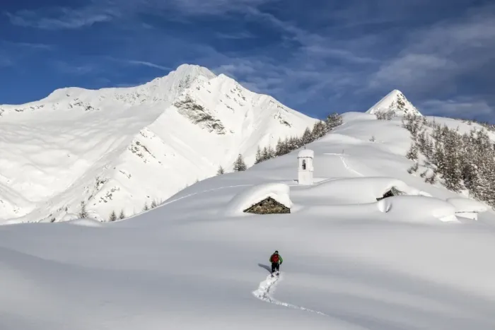 Framed Print : A hiker trying to approach the little village at the Scima Alp covered in snow, Valchiavenna, Lombardy, Italy, Europe Framed Print : A hiker trying to approach the little village at the Scima Alp covered in snow, Valchiavenna, Lombardy, Italy, Europe
