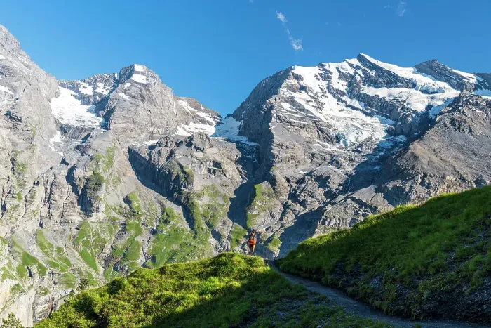 Framed Print : Hiker walks the summer trail surrounded by Swiss glacier, Oeschinensee, Kandersteg, Bern Canton, Switzerland, Europe