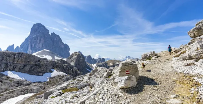 Framed Print : Hiker woman with dog walking on path to the majestic mountain Croda dei Toni in summer Framed Print : Hiker woman with dog walking on path to the majestic mountain Croda dei Toni in summer