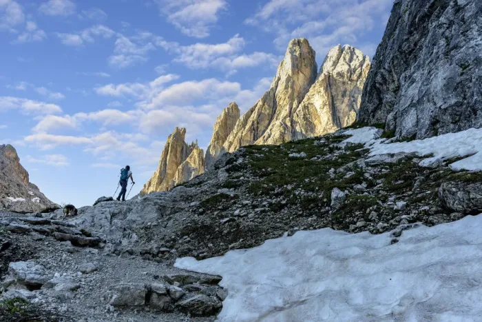 Framed Print : Hiker woman walking on path to majestic Croda Dei Toni mountain at dawn, Val Fiscalina Framed Print : Hiker woman walking on path to majestic Croda Dei Toni mountain at dawn, Val Fiscalina