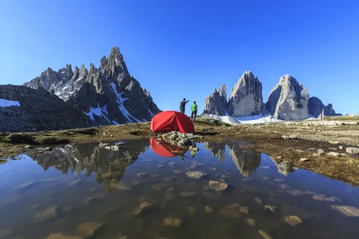 Framed Print : Hikers camped for the night admire the Three Peaks of Lavaredo on awakening, Sesto Framed Print : Hikers camped for the night admire the Three Peaks of Lavaredo on awakening, Sesto