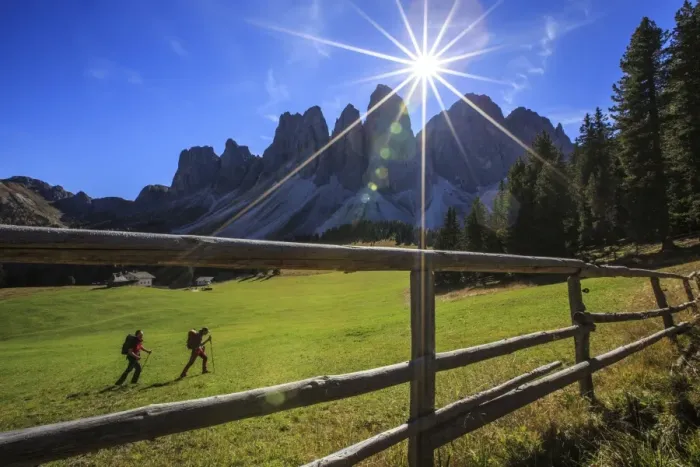Framed Print : Hikers proceed from Glatsch Alm with Odle in background, Funes Valley, South Tyrol Framed Print : Hikers proceed from Glatsch Alm with Odle in background, Funes Valley, South Tyrol