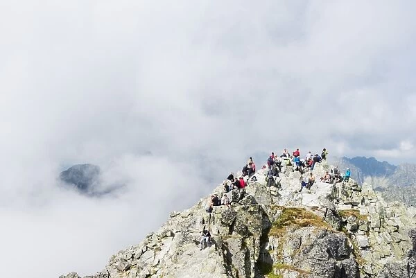 Hikers on summit of Mount Rysy, 2499m, the highest point in Poland, Zakopane, Carpathian Mountains, Poland, Europe