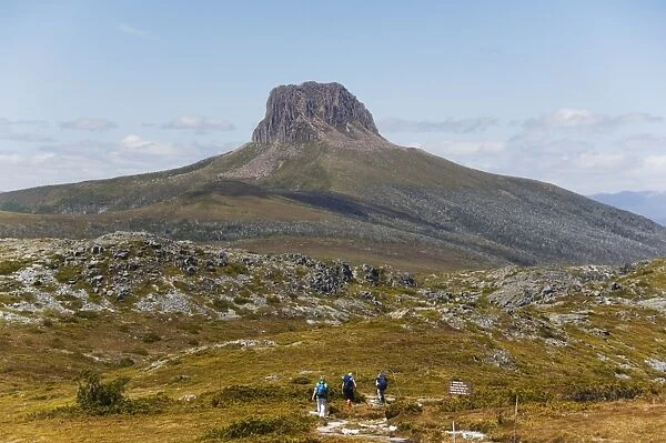 Hikers walking towards Barn Bluff on the overland track in Cradle Mountain Lake St