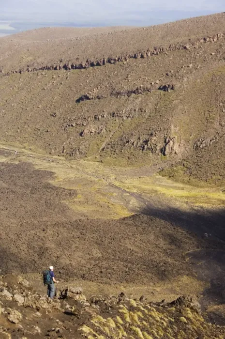 Framed Print : Hikers walking through a lava field on the Tongariro Crossing Framed Print : Hikers walking through a lava field on the Tongariro Crossing