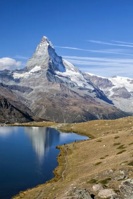 Framed Print : Hikers walking on the path beside the Stellisee with the Matterhorn reflected, Zermatt Framed Print : Hikers walking on the path beside the Stellisee with the Matterhorn reflected, Zermatt