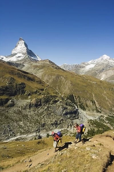 Hikers walking on trail near the Matterhorn
