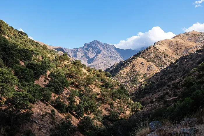 Framed Print : Hiking trail along rugged arid mountain valley of the Sierra Nevada, with Alcazaba in the distance, Andalusia, Spain, Europe Framed Print : Hiking trail along rugged arid mountain valley of the Sierra Nevada, with Alcazaba in the distance, Andalusia, Spain, Europe