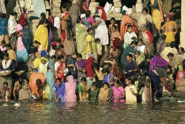 Hindus bathing in the early mornin in the holy river Ganges
