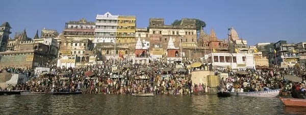 Hindus bathing in the early morning in the holy river Ganges