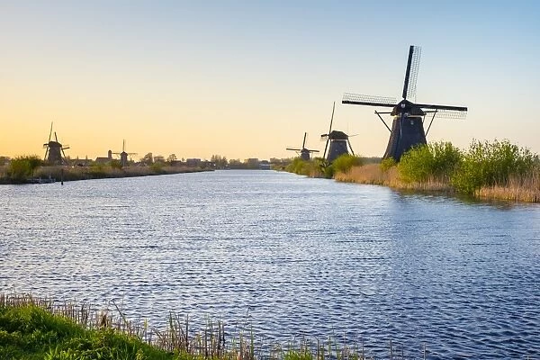 Historic Dutch windmills on the polders at sunset, Kinderdijk, UNESCO World Heritage Site