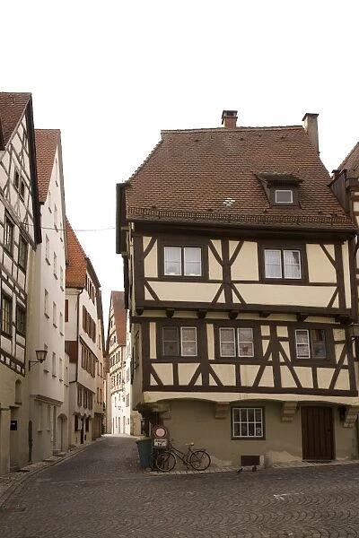Historic half-timbered houses typical of the city stand close to the Meztgerturm in Ulm