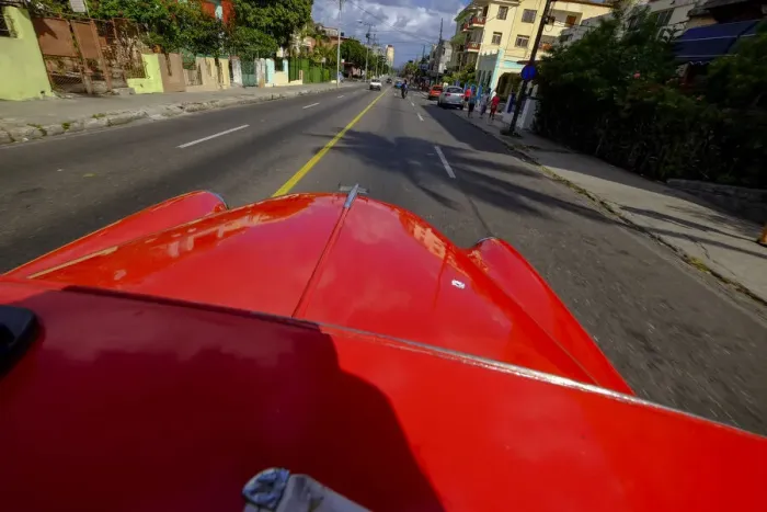 Framed Print : The hood of a vintage car driving the streets of Havana, Havana, Cuba, West Indies Framed Print : The hood of a vintage car driving the streets of Havana, Havana, Cuba, West Indies
