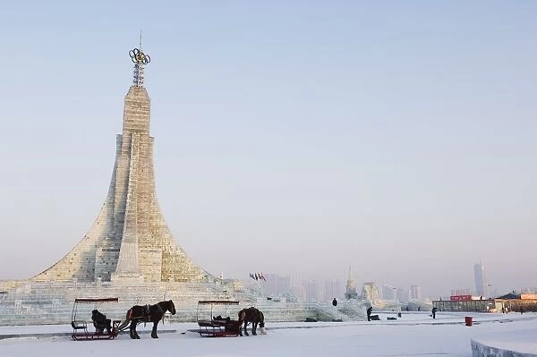 A horse and carriage and ice sculptures at the Ice Lantern Festival, Harbin