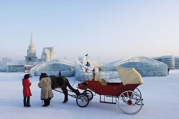 A horse and carriage ride and snow and ice sculptures at the Ice Lantern Festival