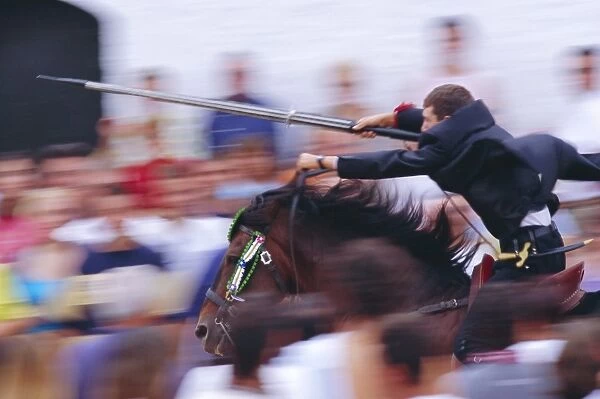 Horse rider jousting with target during the Sant Joans festival