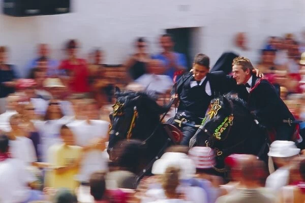 Horsemen riding together during the Sant Joans festival