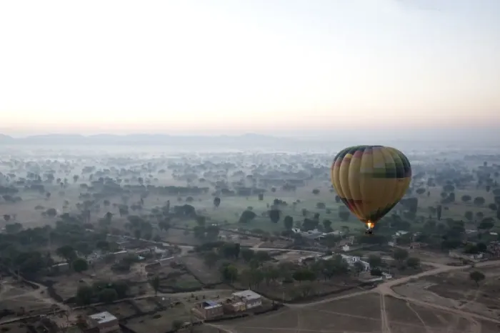 Framed Print : Hot air balloon in the early morning, flying over countryside and the village of Samode Framed Print : Hot air balloon in the early morning, flying over countryside and the village of Samode