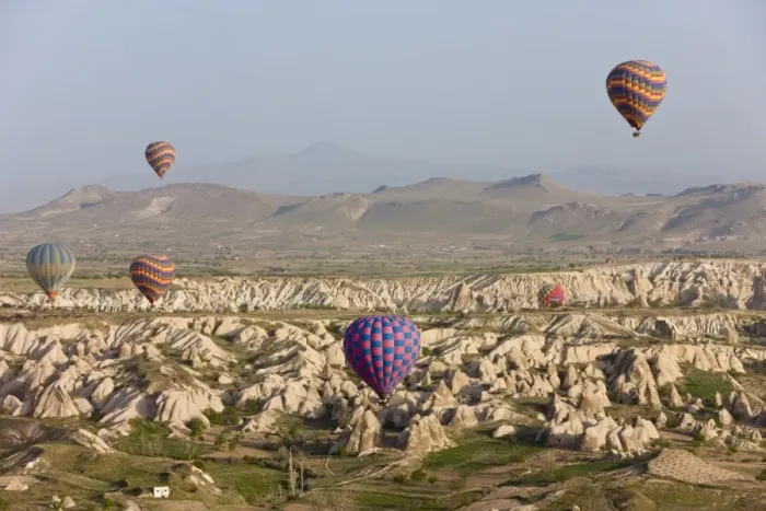 Framed Print : Hot air balloon flight over the famous volcanic tufa rock formations around Goreme Framed Print : Hot air balloon flight over the famous volcanic tufa rock formations around Goreme
