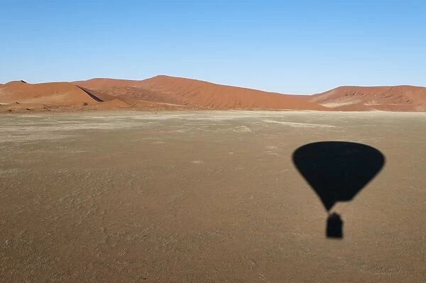 Hot air balloon shadow on desert, Namib Naukluft Park, Namib Desert, Namibia, Africa