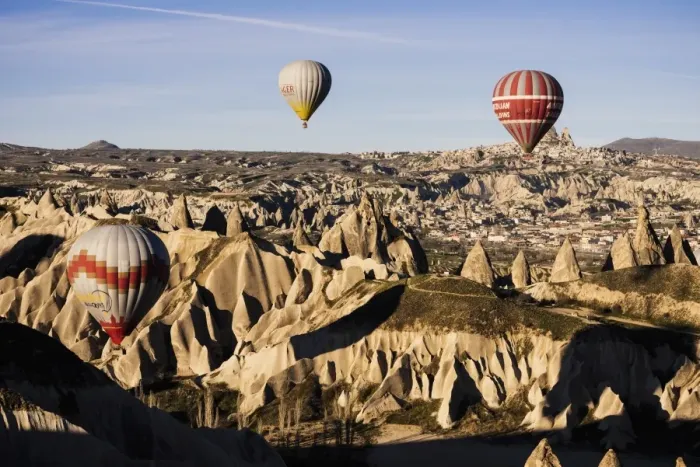 Framed Print : Hot air balloons flying among rock formations at sunrise in the Red Valley, Goreme National Park Framed Print : Hot air balloons flying among rock formations at sunrise in the Red Valley, Goreme National Park