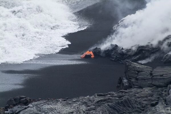 Hot lava flowing onto beach and into the ocean