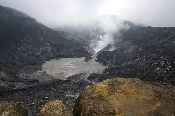 Hot volcanic steam rising into monsoon clouds from Kawah Ratu (Queens Crater) of Mount Tangkuban, Perahu, Bandung, Java, Indonesia, Southeast Asia, Asia