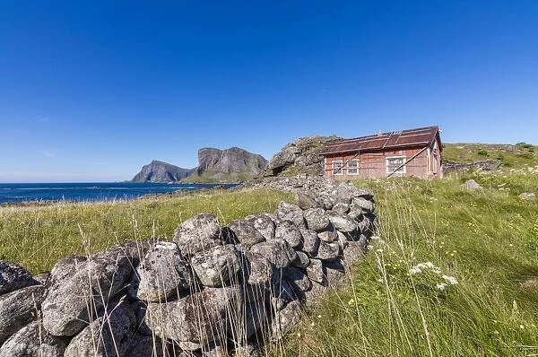 House of fishermen called rorbu surrounded by sea, Sorland, Vaeroy Island, Nordland county