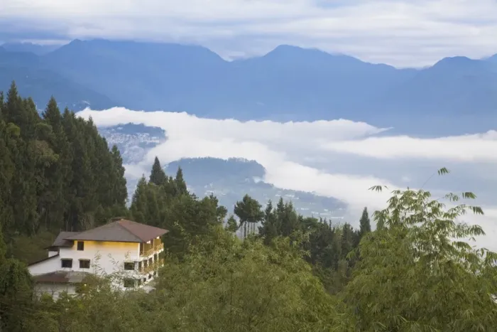 Framed Print : House near Rumtek Gompa Complex overlooking Gangtok with clouds drifting over city Framed Print : House near Rumtek Gompa Complex overlooking Gangtok with clouds drifting over city