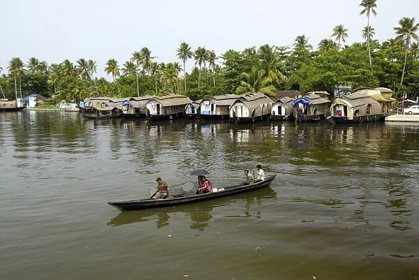 Houseboats moored in the backwaters of Alleppey, Kerala, India