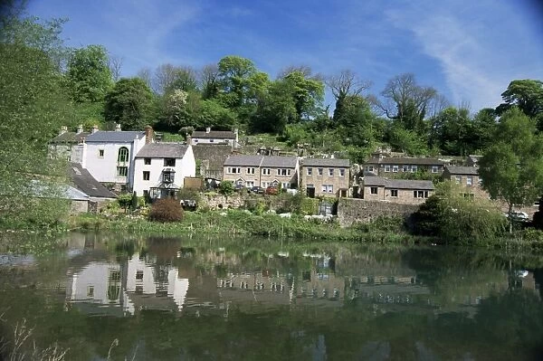 Houses beside the Comford mill pond, Matlock, Derbyshire, England, United Kingdom, Europe