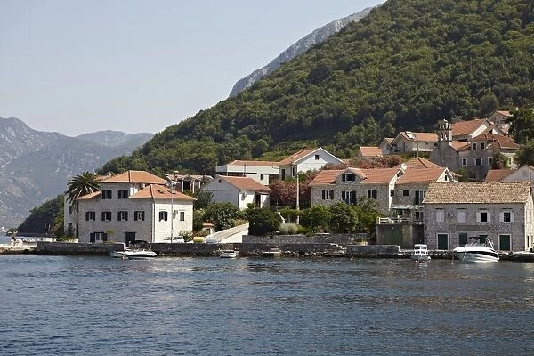 Houses on the edge of The Bay of Kotor, Montenegro, Europe