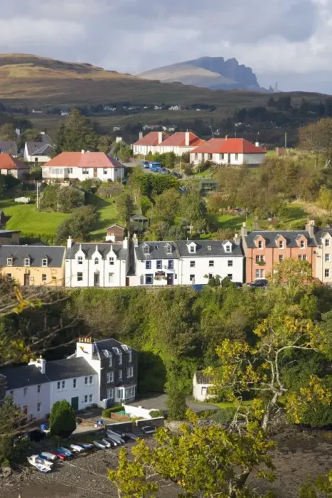 Framed Print : Houses on hillside overlooking the harbour, the Storr visible on horizon Framed Print : Houses on hillside overlooking the harbour, the Storr visible on horizon